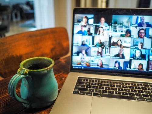 Computer showing a virtual meeting.