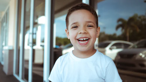 Young student in a white shirt, smiling