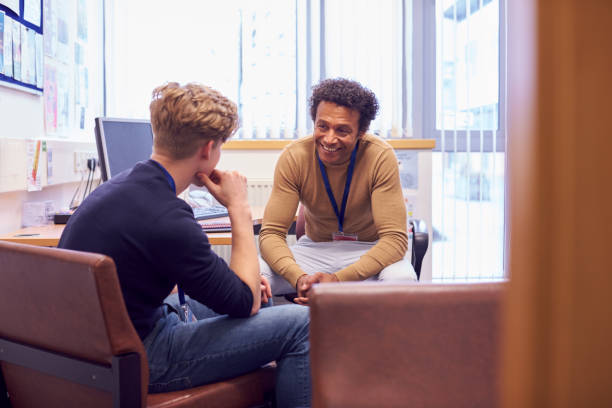 A picture of an adult debriefing with a student.